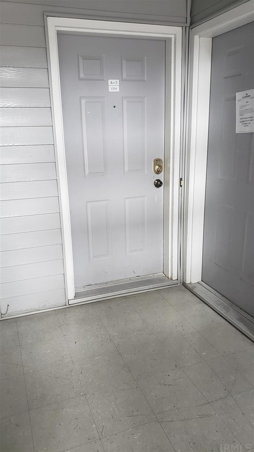 inside stairwell. Main level condo.