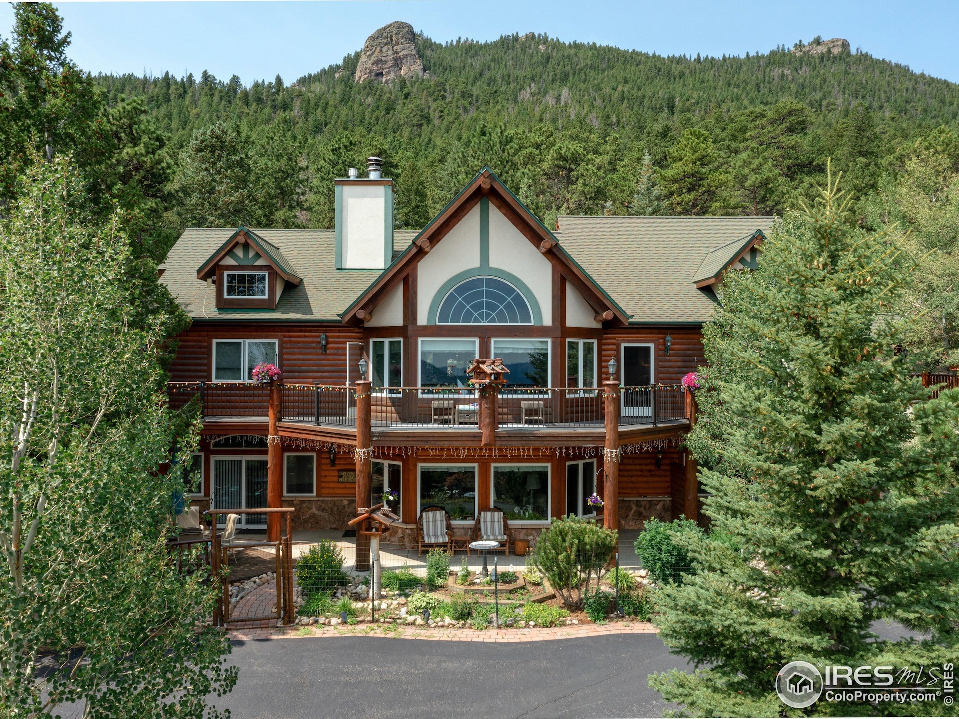 7.83 acre lot full of mature trees & rock out croppings ready to explore