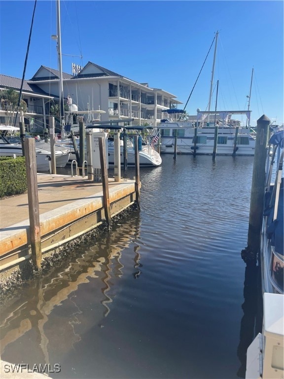Dock area featuring a water view