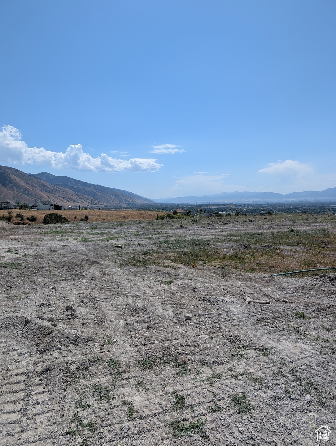 View of mountain backdrop with rural landscape