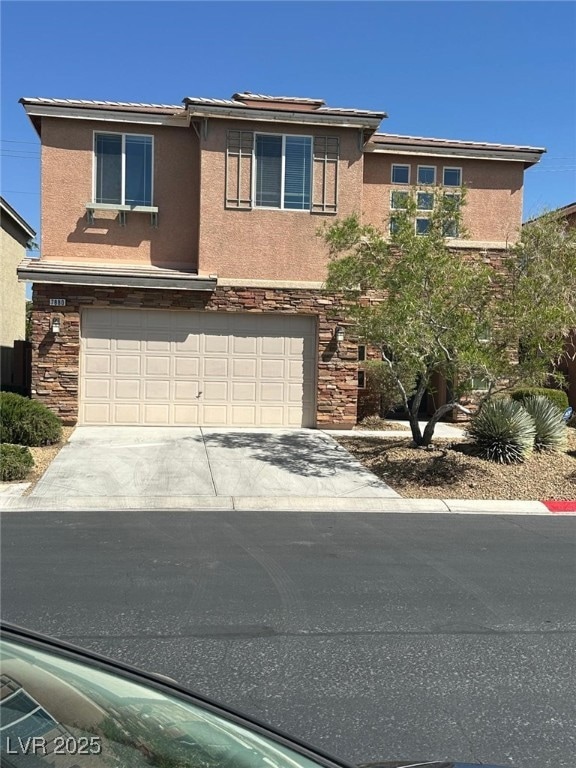 View of front of house with an attached garage, st