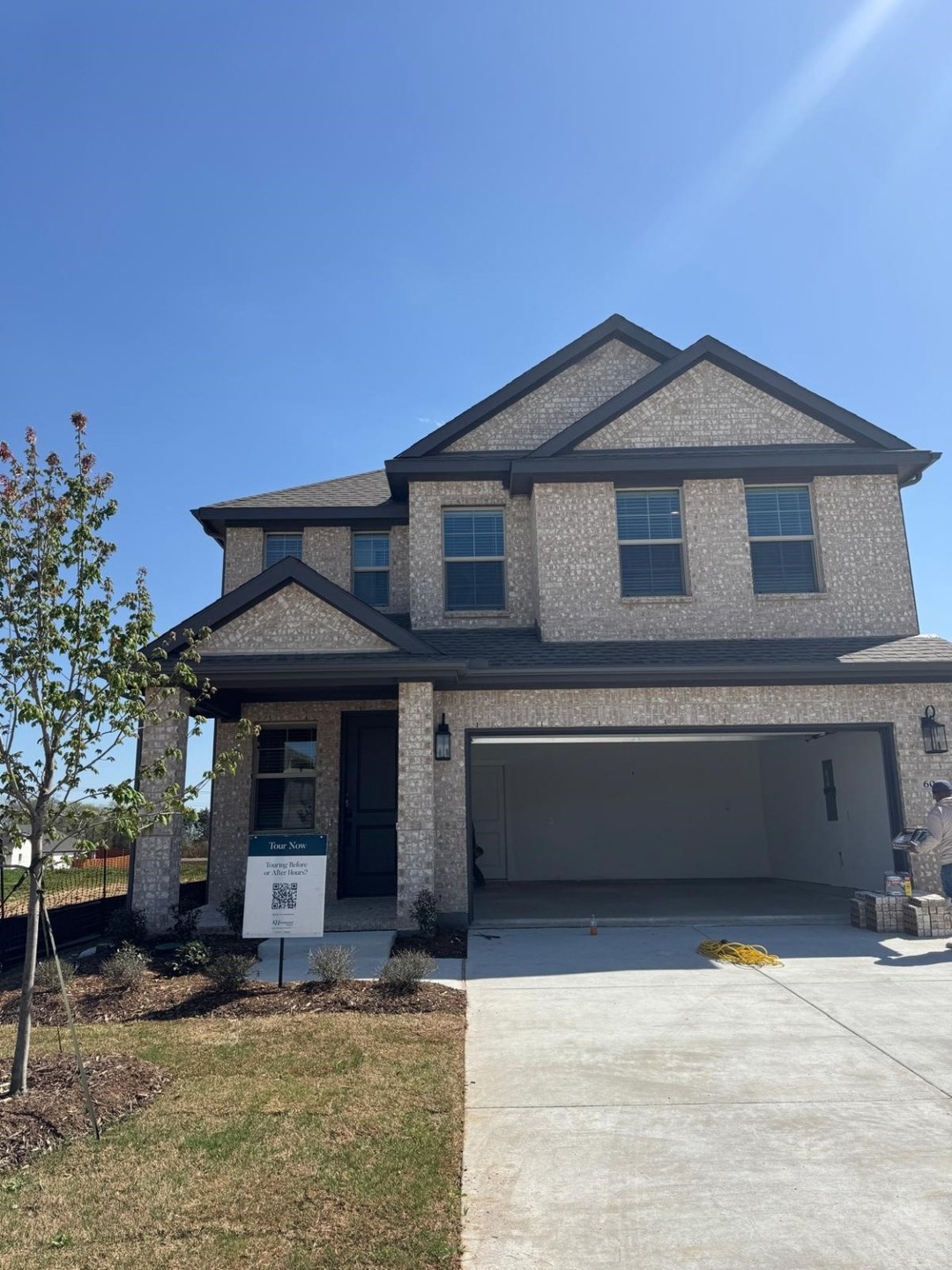 View of front facade featuring an attached garage and concrete driveway