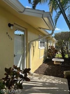 View of side of property with a patio area