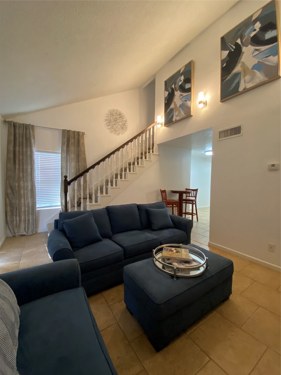 This cozy living space features high ceilings and