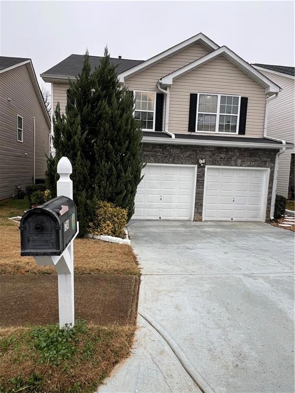View of front of home featuring an attached garage