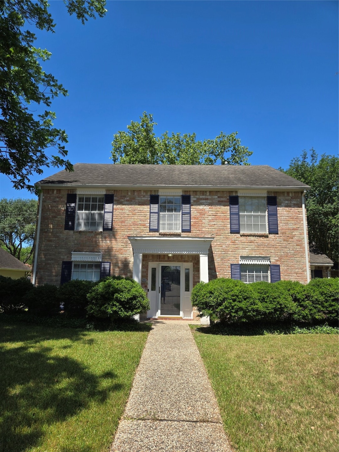 Charming two-story brick home with classic shutter