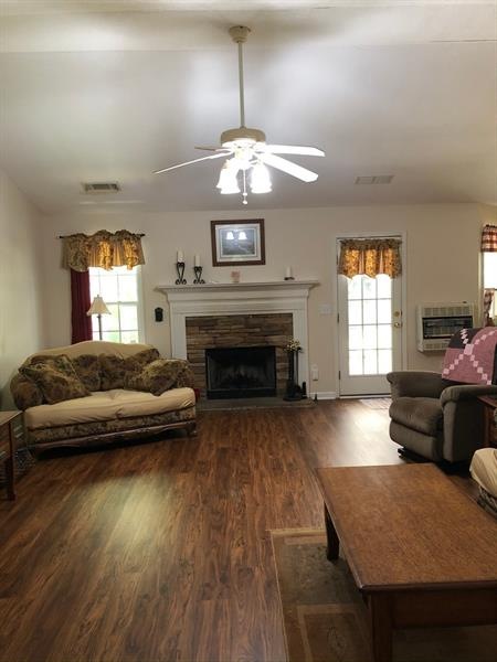 roomy vaulted ceiling great room with fireplace an