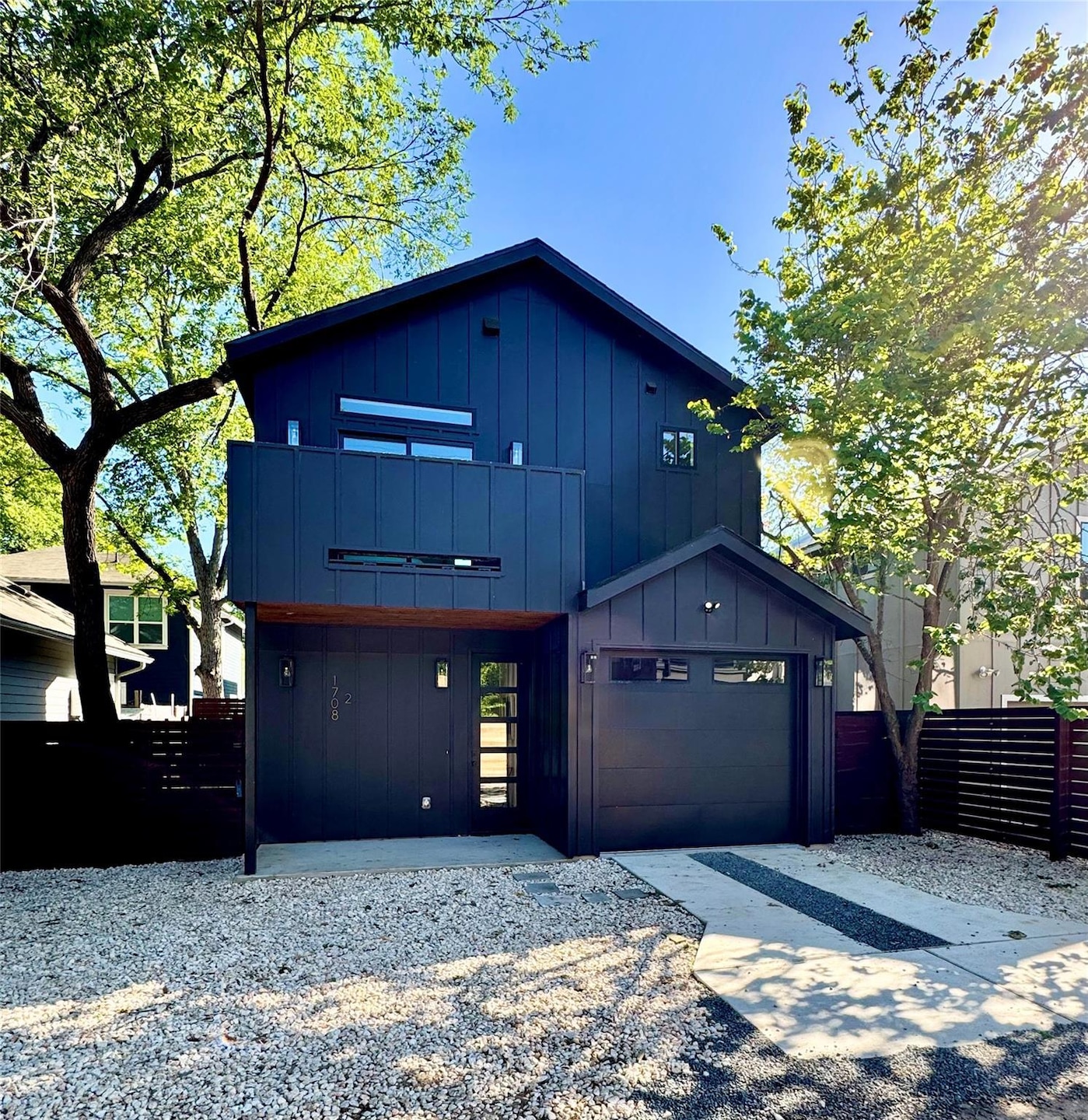 View of front facade with board and batten siding