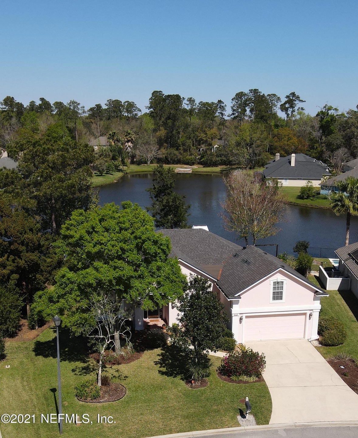 Front Aerial View Featuring Pond