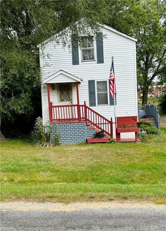 View of front of property with a front lawn