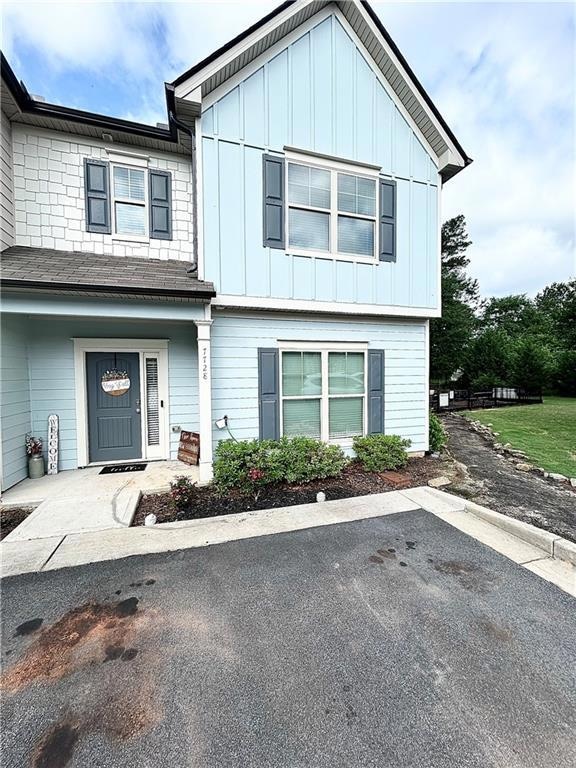 View of front of property with board and batten siding