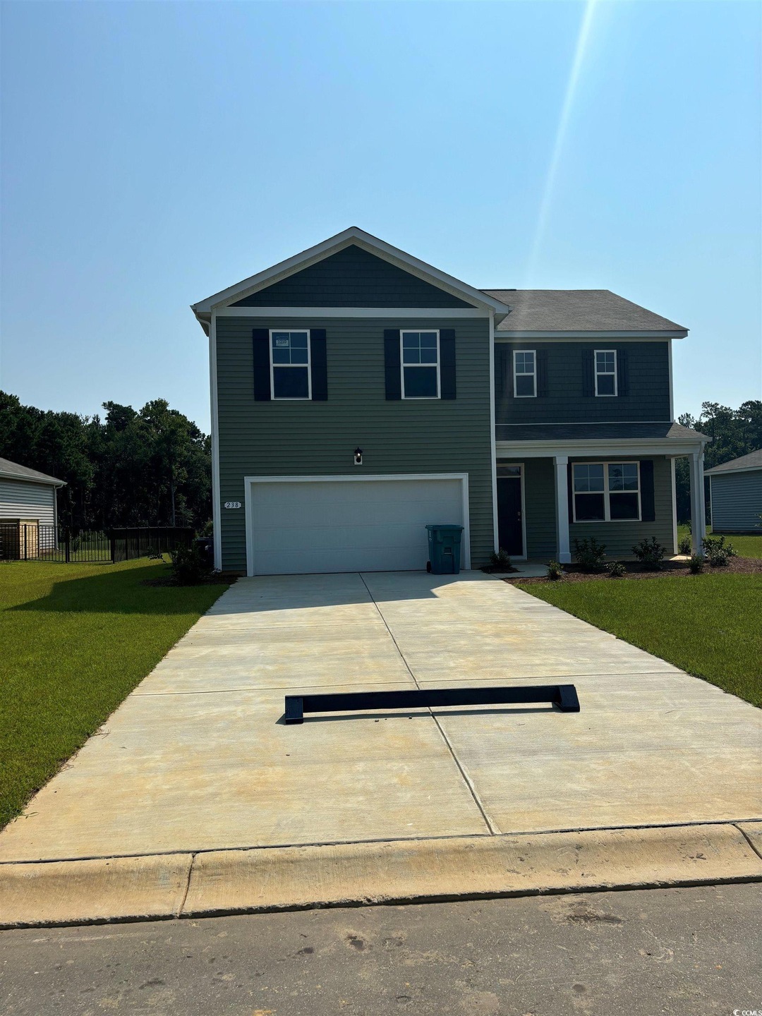 View of front of house with a garage and a front l