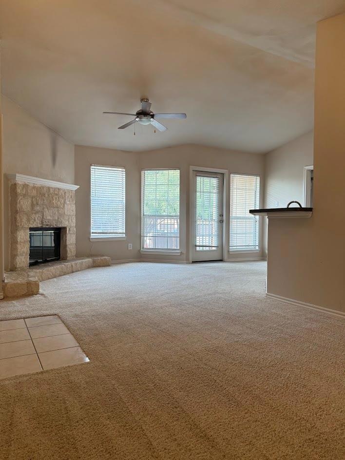 Unfurnished living room featuring carpet floors, 
