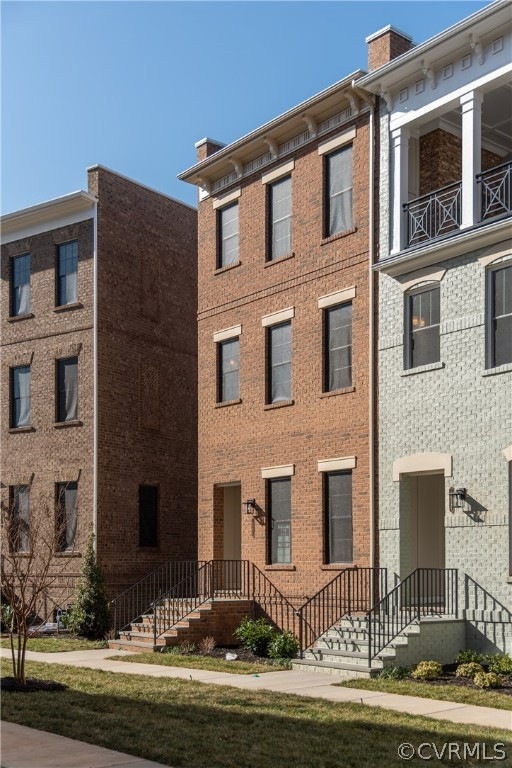 Greek Revival style exterior, facing a landscaped