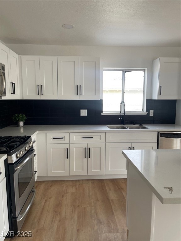 Kitchen with a sink, tasteful backsplash, dishwash