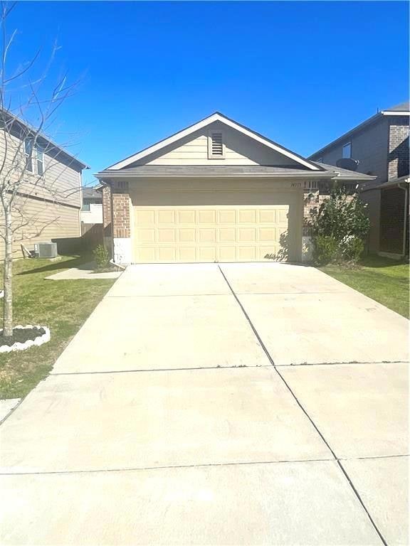 Single story home with concrete driveway, a garag