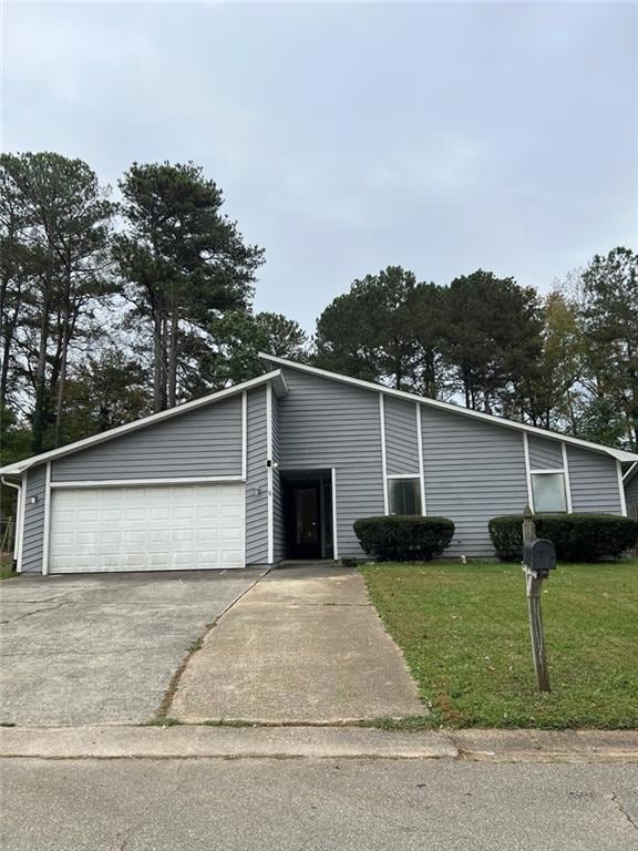View of front of property featuring a garage and a