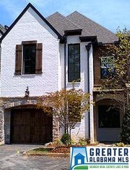 Gorgeous painted brick exterior with rock and ceda