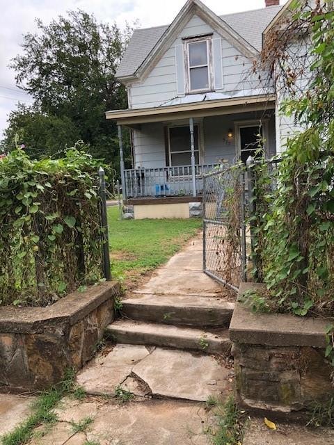 View of front of property with covered porch