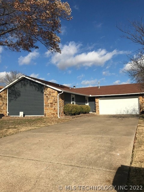 Extra long drive way, 2 car garage with shelves.