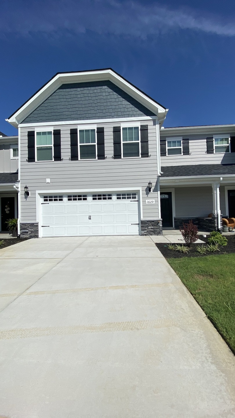 New Wilkerson Downs town homes 2 bedroom 2 1/2 bath, 2 car garage with a large covered back porch, Blinds, Appliances and more!  Photo file