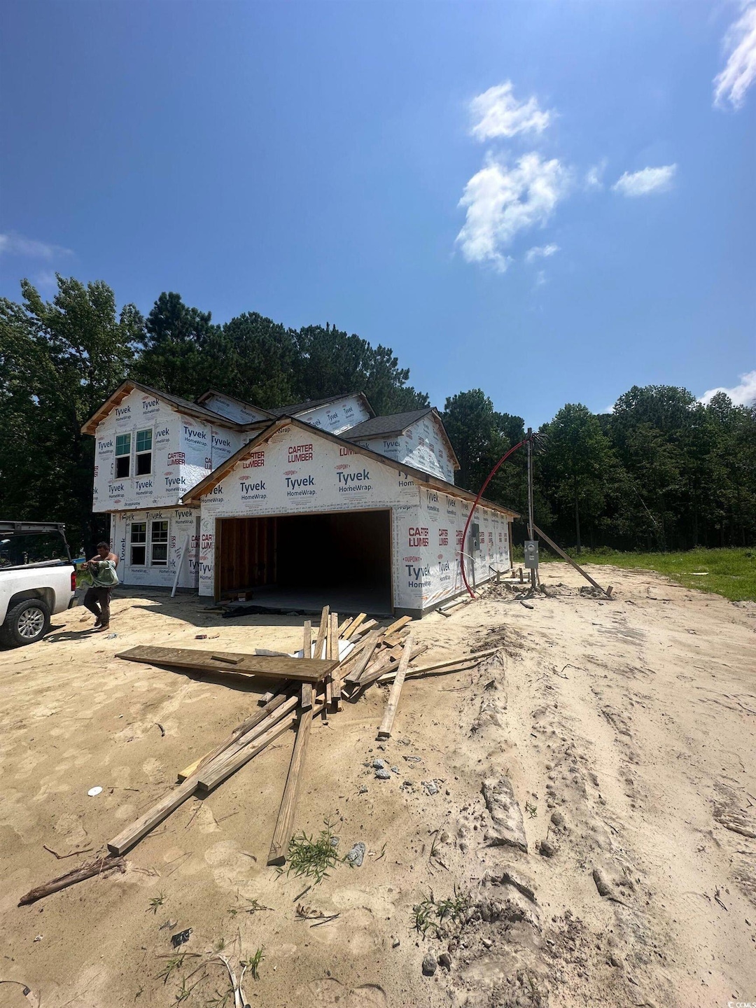 View of front of home with an attached garage and driveway