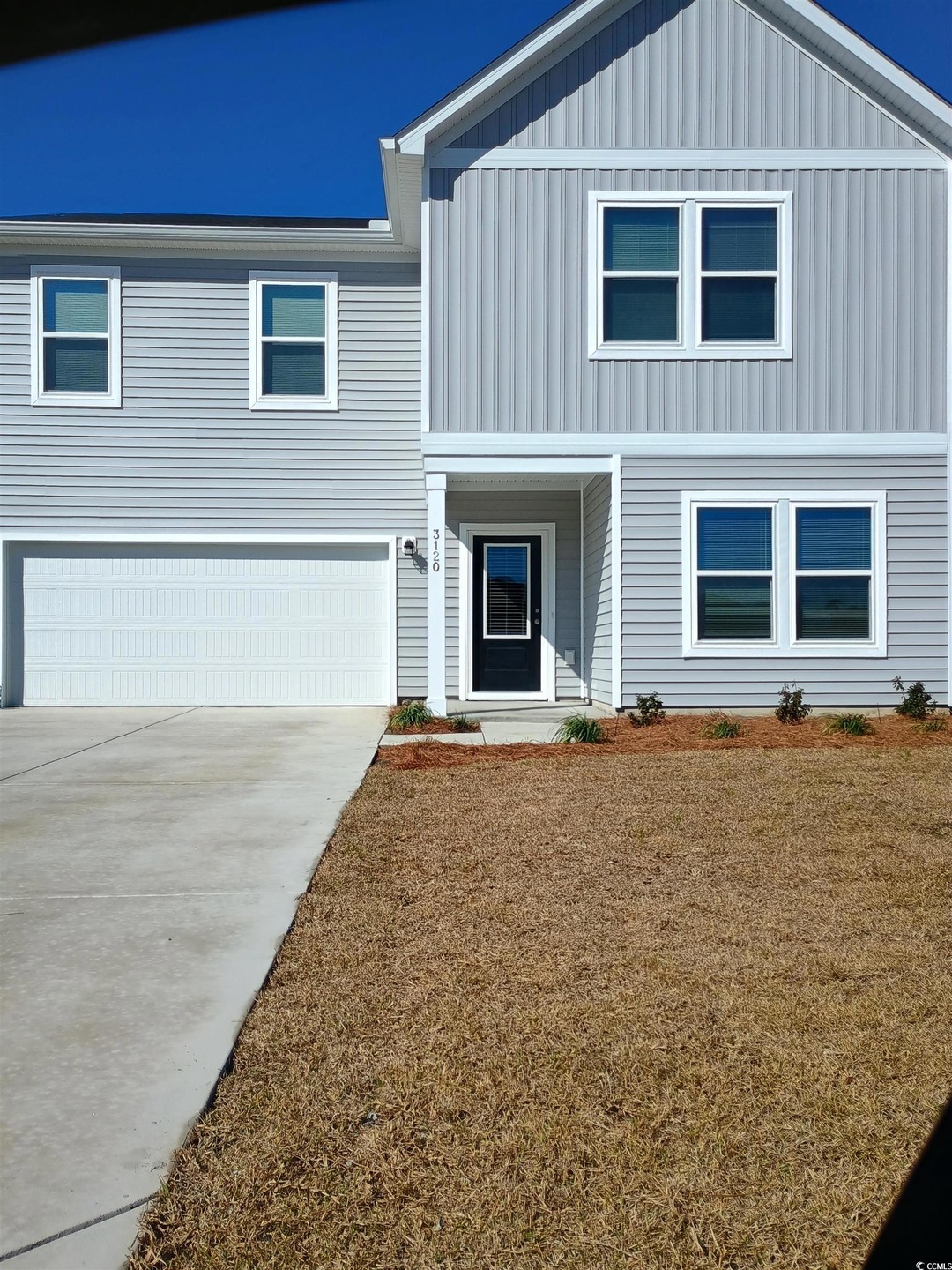 View of front of house featuring board and batten 