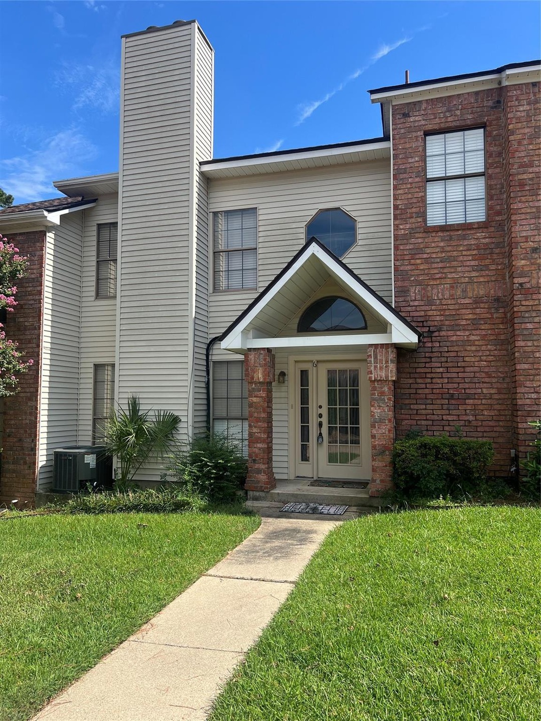 View of front of house featuring central air condi