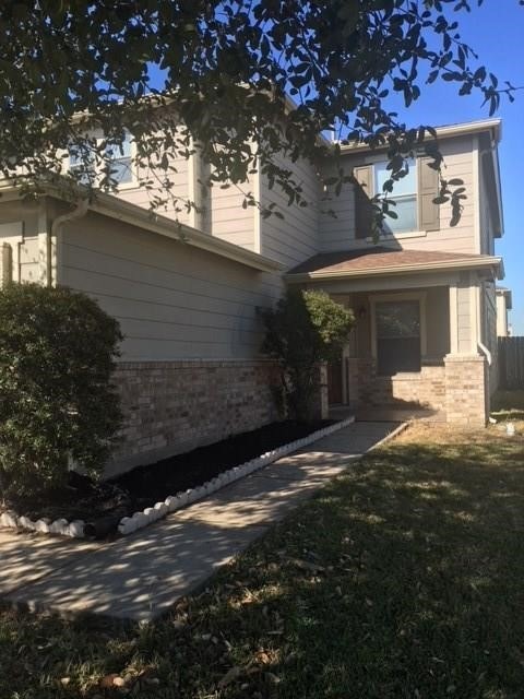 Front walkway leading to welcoming porch
