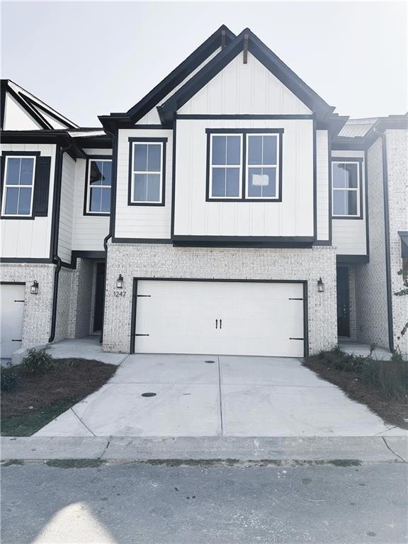 Townhome / multi-family property with a garage