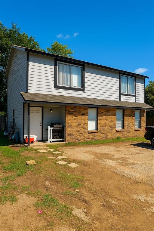 Back of house with brick siding