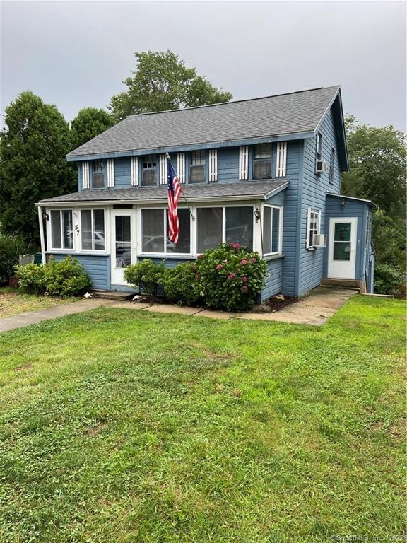 Front of house with a large front yard
