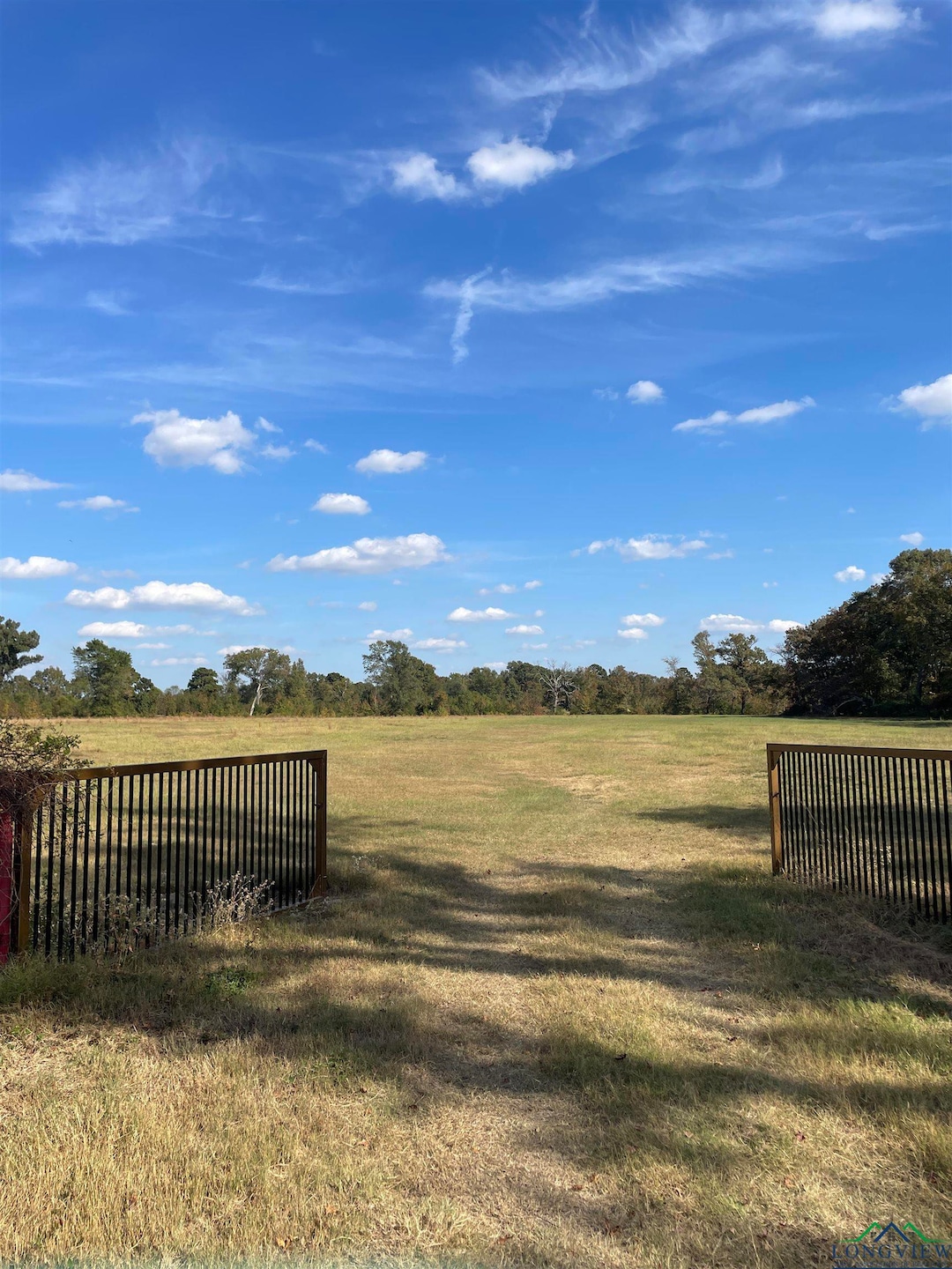 View of yard with a rural view