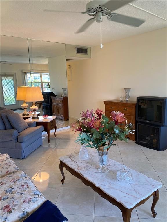 Large living room with tile on the diagonal.