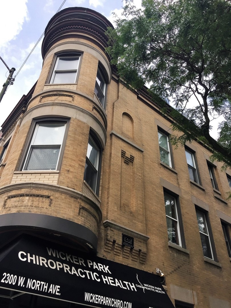 Charming corner building with gorgeous bay windows