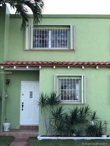 TOWNHOUSE ENTRANCE WITH PARKING AT THE FRONT