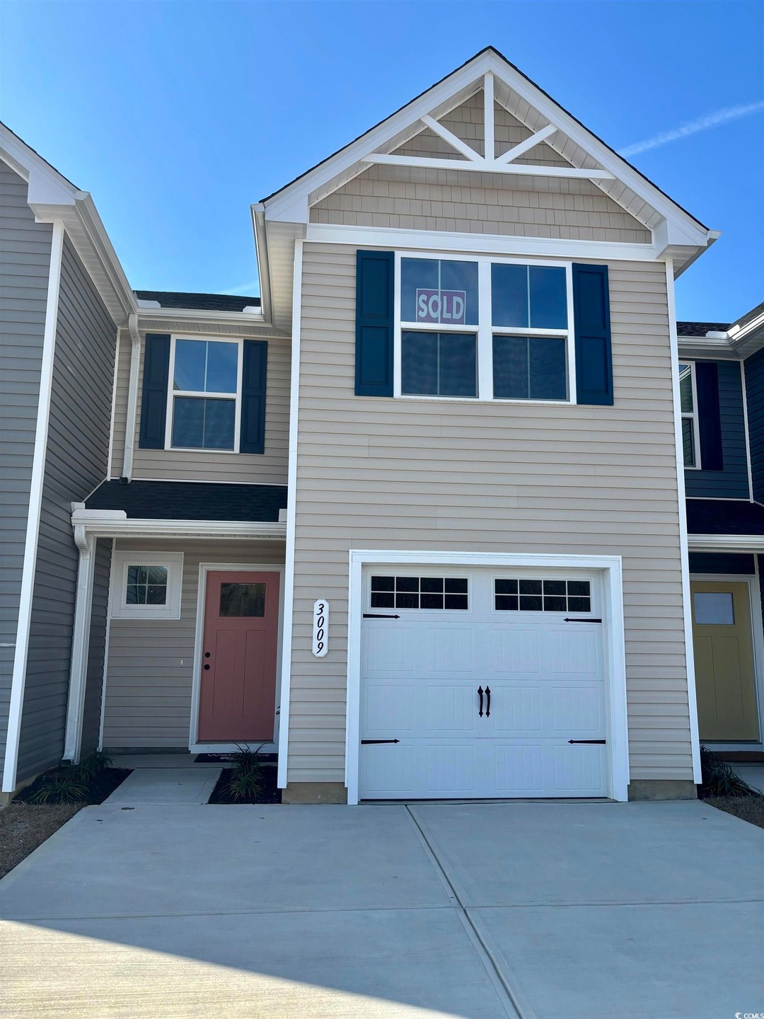 View of front facade featuring a garage