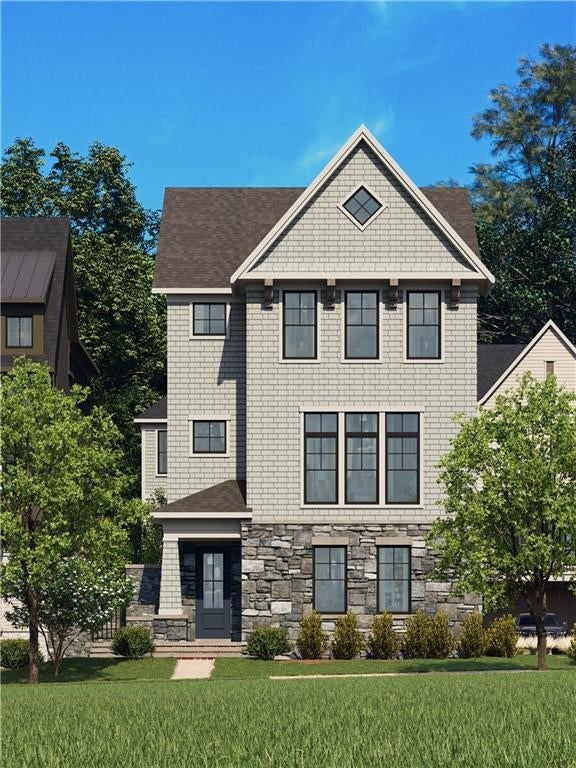 This Elegant exterior offers a timeless classic look rich with natural hand cut stone, shake siding and black windows are perfect compliments this Park Facing home.