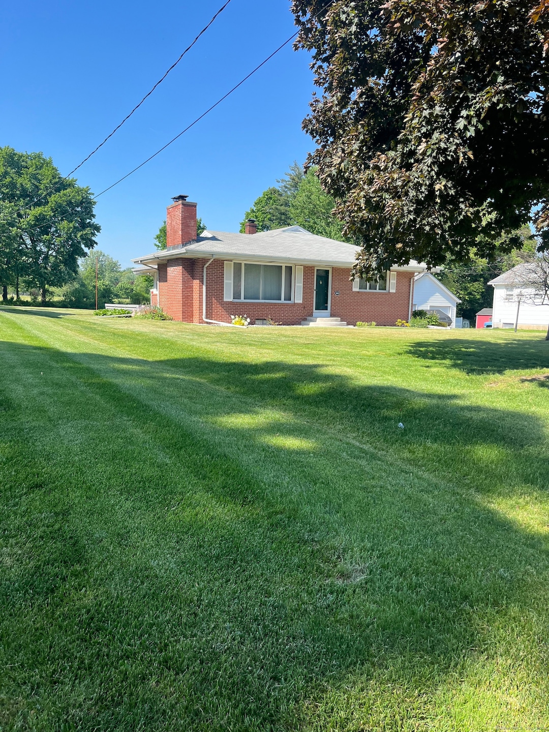 Welcome to 161 Spring St, a 4 bed (1 in lower level), 2 bath 1575sf custom brick ranch