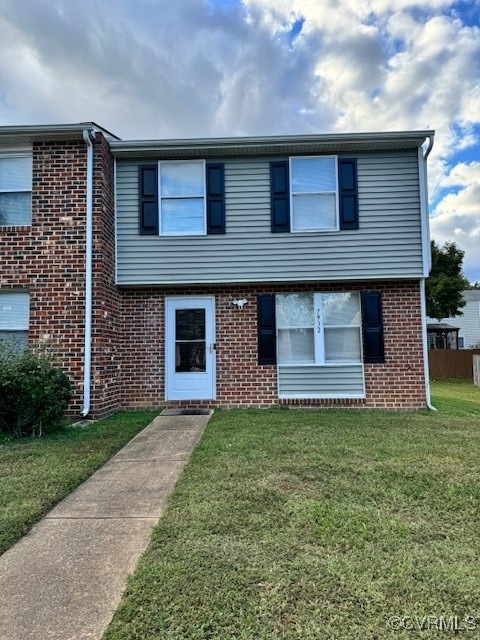 View of front of property with a front lawn