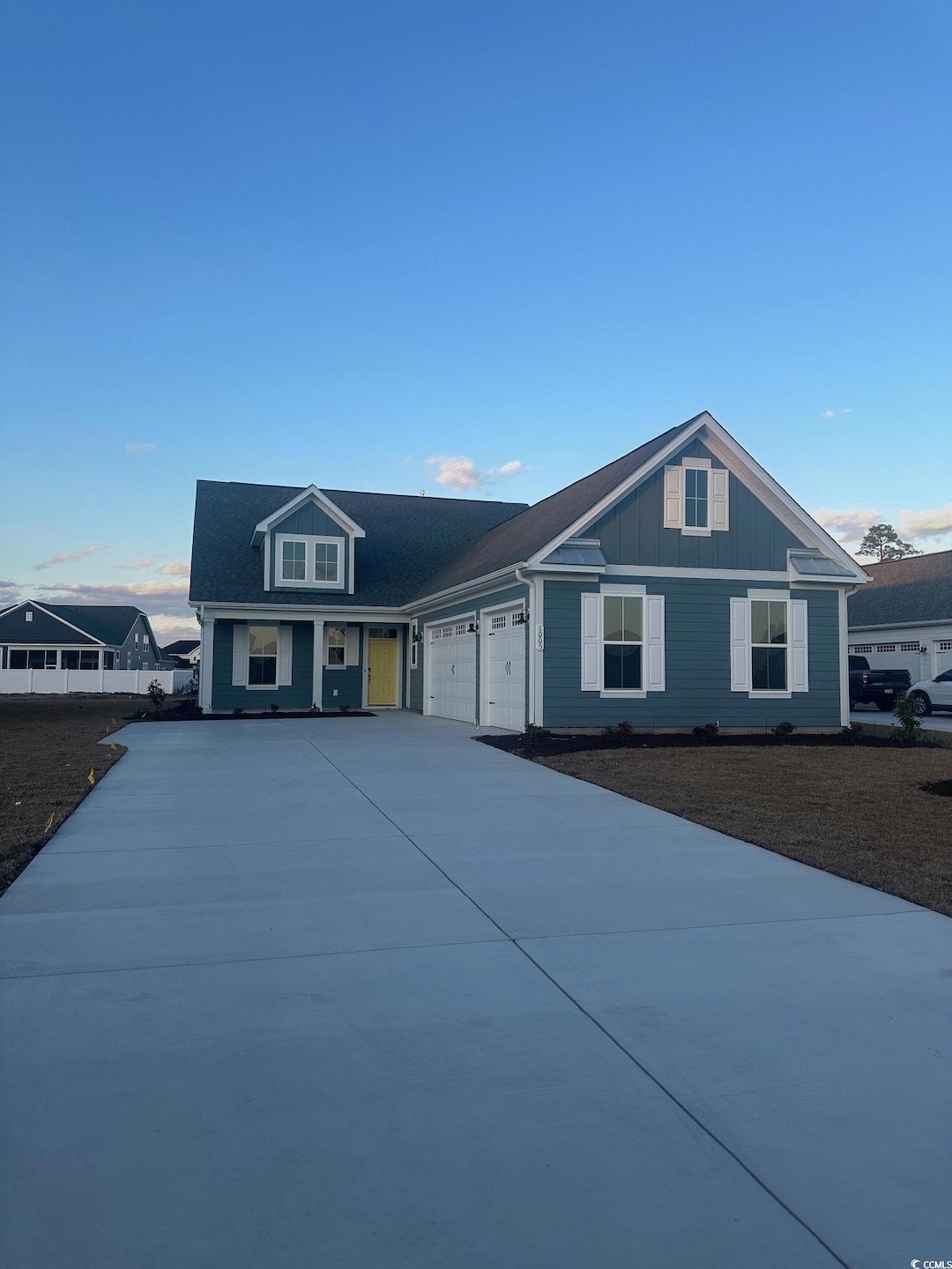 View of front of property featuring a garage
