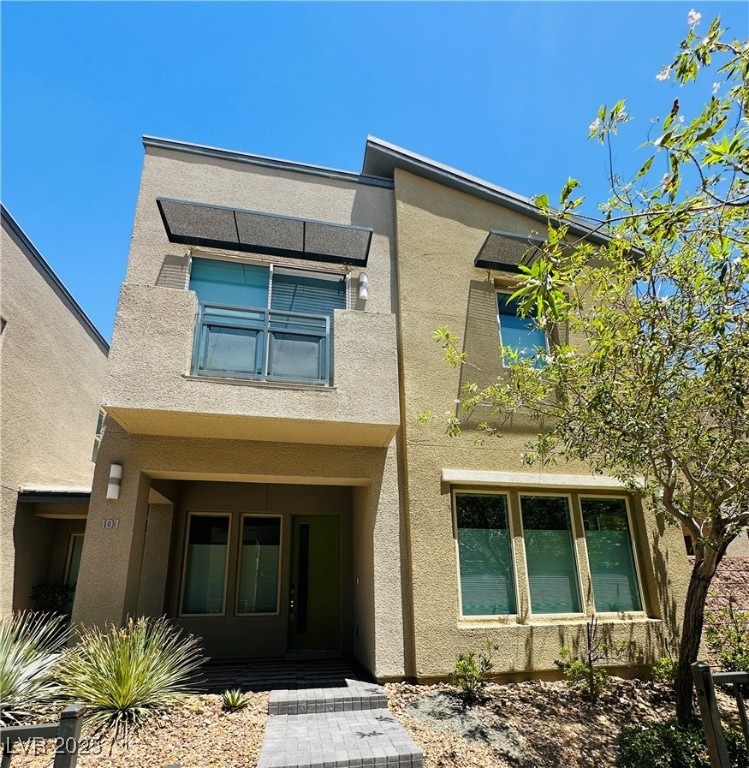 View of front of home with stucco siding