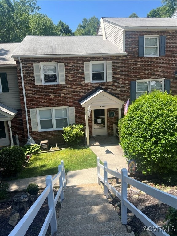 View of front of home with brick siding