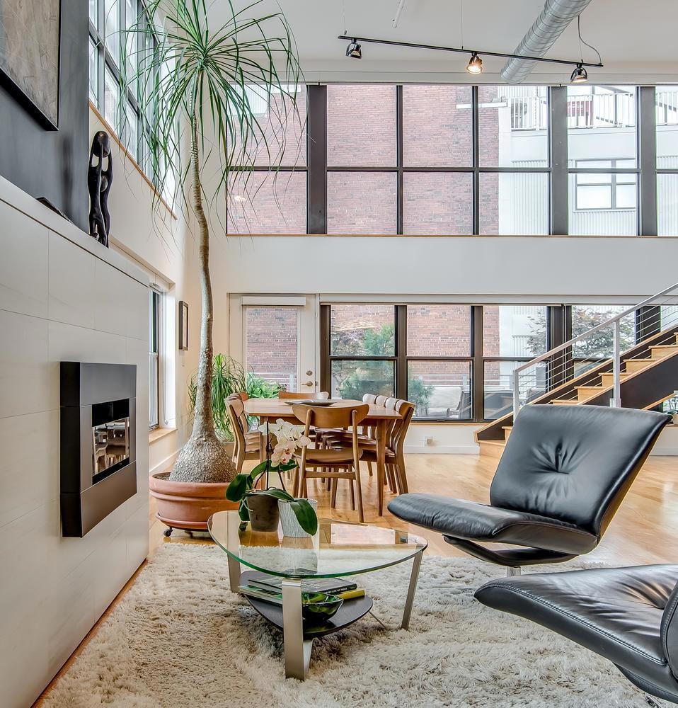 Amazing corner unit with 20 ft ceilings. Cozy nook in front of the ventless gas fireplace.