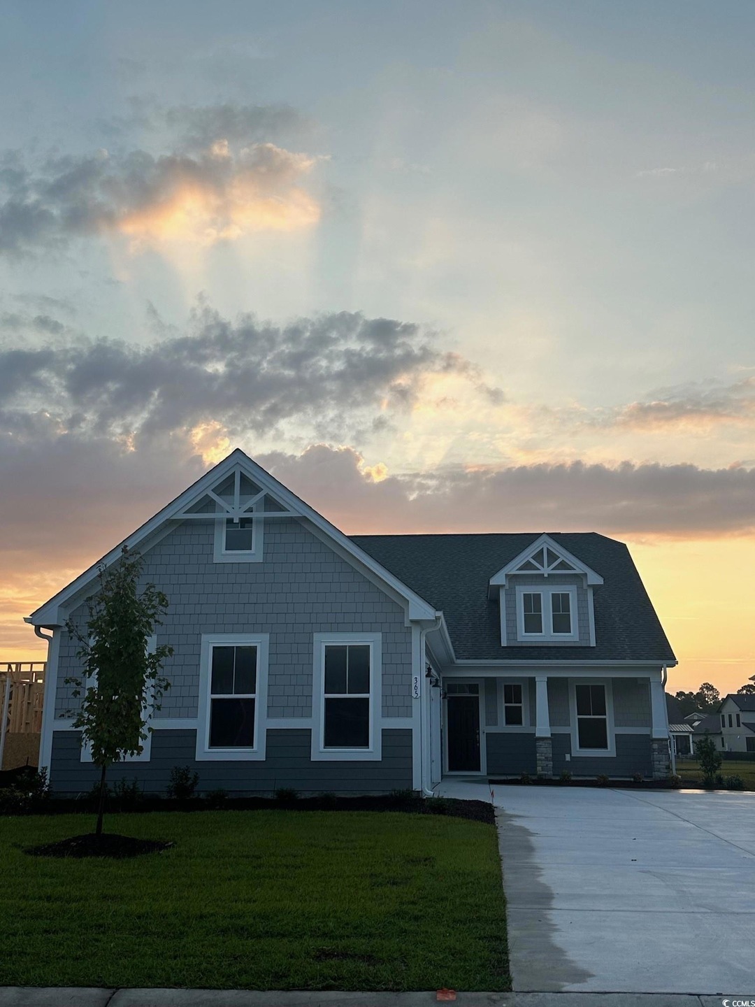 View of front of property with a lawn