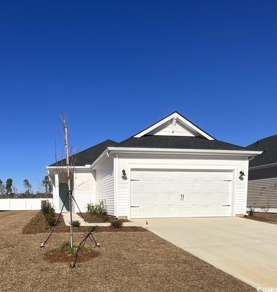 Single story home featuring a garage