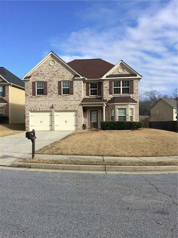 Exterior of home with brick front and hardi plank 