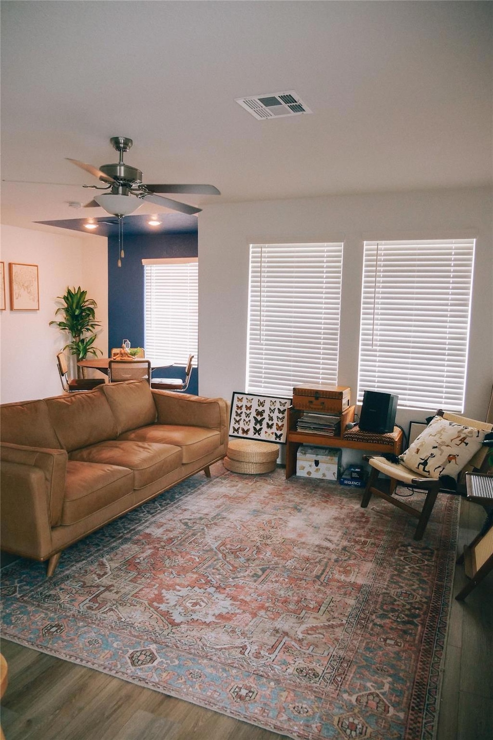 Living room featuring wood finished floors and ce