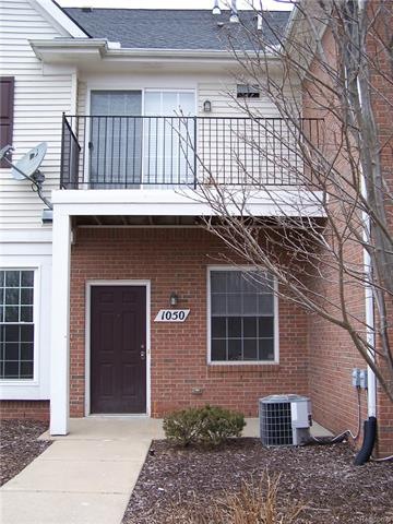 Front door and balcony above.