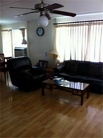 Beautiful living room flooring with ceiling fans